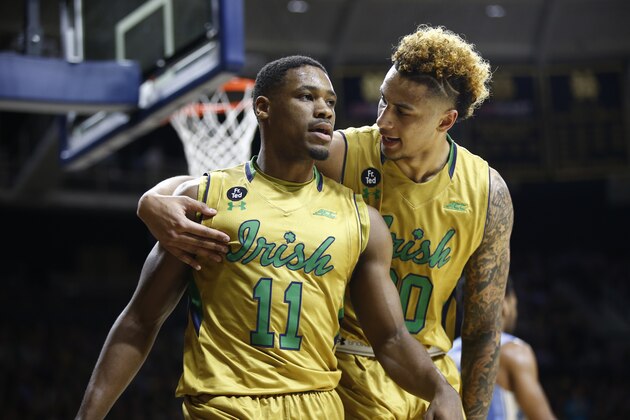 SOUTH BEND, IN - FEBRUARY 6: Demetrius Jackson #11  and Zach Auguste #30 of the Notre Dame Fighting Irish react after a play against the North Carolina Tar Heels at Purcell Pavilion on February 6, 2016 in South Bend, Indiana.  (Photo by Michael Hickey/Getty Images)