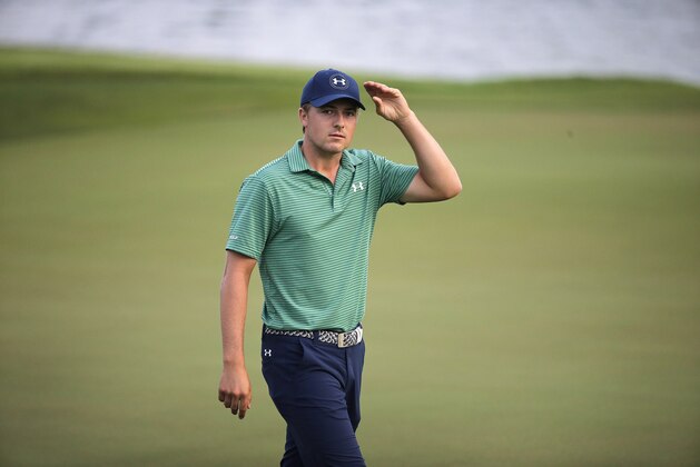 Jordan Spieth of the United States walks off the 18th hole after the final round of the SMBC Singapore Open golf tournament at Sentosa Golf Club's Serapong Course on Monday, Feb. 1, 2016, in Singapore. (AP Photo/Wong Maye-E)