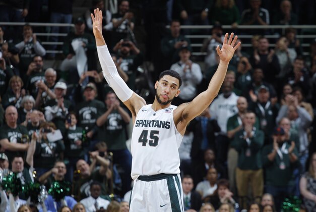 Michigan State's Denzel Valentine acknowledges the crowd as he comes out of the game in the closing minute of an NCAA college basketball game against Ohio State, Saturday, March 5, 2016, in East Lansing, Mich. Michigan State won 91-76. (AP Photo/Al Goldis)