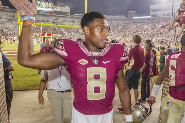 Florida State defensive back Jalen Ramsey, left, and quarterback Everett Golson are congratulated on their way to the dressing room after an NCAA college football game against Texas State in Tallahassee, Fla., Saturday, Sept. 5, 2015.  Florida State defeated Texas State 59-16. (AP Photo/Mark Wallheiser)