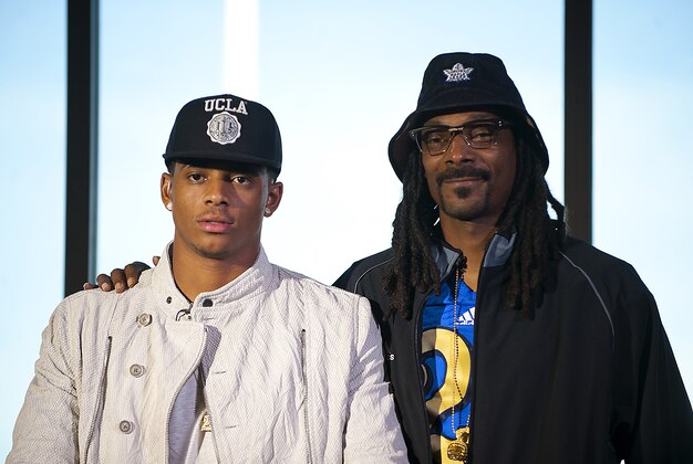 Feb 4, 2015; Las Vegas, NV, USA; Recording artist Snoop Dogg stands beside his son Cordell Broadus who announced his commitment to UCLA during a press conference at Bishop Gorman High School. Mandatory Credit: Stephen R. Sylvanie-USA TODAY Sports
