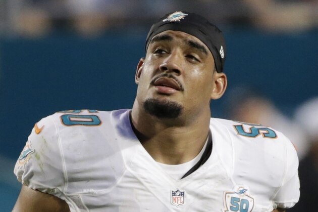 FILE - In this Sept. 27, 2015, file photo, Miami Dolphins defensive end Olivier Vernon (50) walks off the field during the second half of an NFL football game against the Buffalo Bills, in Miami Gardens, Fla. Defensive end Olivier Vernon's transition tag has been removed by the Dolphins, allowing him to become a free agent hours after the team signed Mario Williams as a replacement. The transition tag was for $12.734 million, but the Dolphins withdrew the offer Wednesday, March 9, 2016, making it likely Vernon will depart after four seasons in Miami. (AP Photo/Wilfredo Lee, File)