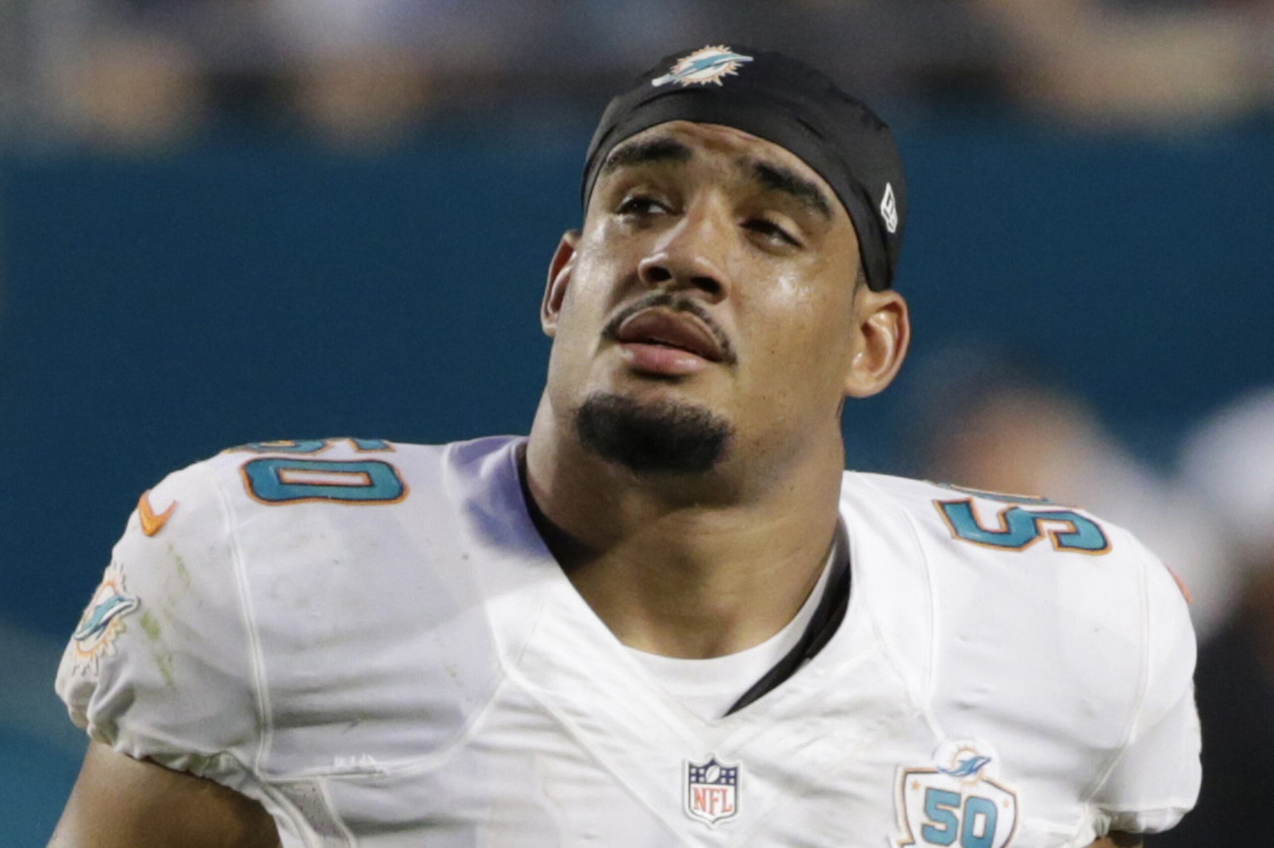 FILE - In this Sept. 27, 2015, file photo, Miami Dolphins defensive end Olivier Vernon (50) walks off the field during the second half of an NFL football game against the Buffalo Bills, in Miami Gardens, Fla. Defensive end Olivier Vernon's transition tag has been removed by the Dolphins, allowing him to become a free agent hours after the team signed Mario Williams as a replacement. The transition tag was for $12.734 million, but the Dolphins withdrew the offer Wednesday, March 9, 2016, making it likely Vernon will depart after four seasons in Miami. (AP Photo/Wilfredo Lee, File)