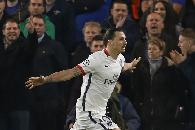 PSG's Zlatan Ibrahimovic celebrates scoring his side’s second goal during the round of sixteen second leg Champions League soccer match between Chelsea and Paris Saint-Germain at Stamford Bridge stadium in London, Wednesday, March 9, 2016. (AP Photo/Kirsty Wigglesworth)