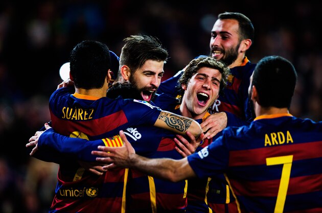 BARCELONA, SPAIN - FEBRUARY 28:  Gerard Pique of Barcelona is celebrated by his team after scoring his team's second goal during the La Liga match between FC Barcelona and Sevilla FC at Camp Nou on February 28, 2016 in Barcelona, Spain.  (Photo by Vladimir Rys Photography/Getty Images)