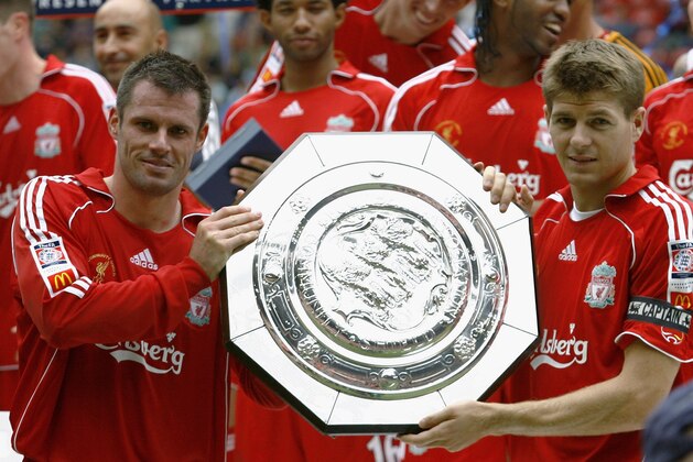 CARDIFF, UNITED KINGDOM - AUGUST 13:  Jamie Carragher (L) and Steven Gerrard of Liverpool hold the trophy following their team's victory during the FA Community Shield match between Liverpool and Chelsea at the Millennium Stadium on August 13, 2006 in Cardiff, Wales.  (Photo by Shaun Botterill/Getty Images)