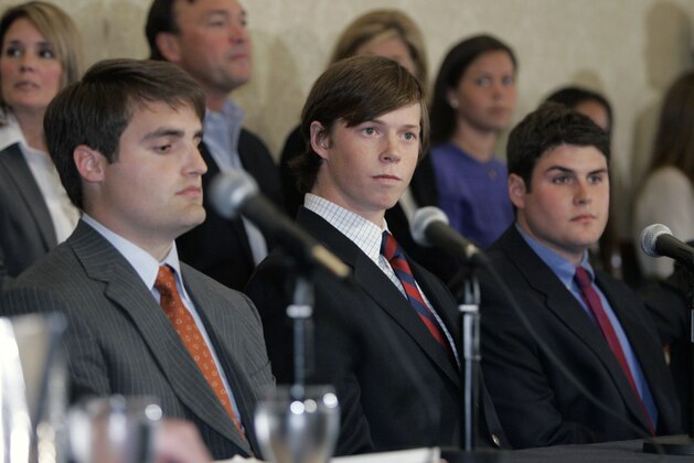 Dave Evans, left, Collin Finnerty, center, and Reade Seligmann, right, look on during a news conference in Raleigh, N.C., Wednesday, April 11, 2007. Prosecutors have decided to drop all remaining charges against three Duke lacrosse players accused of sexually assaulting a stripper at a team party. (AP Photo/Chuck Burton)