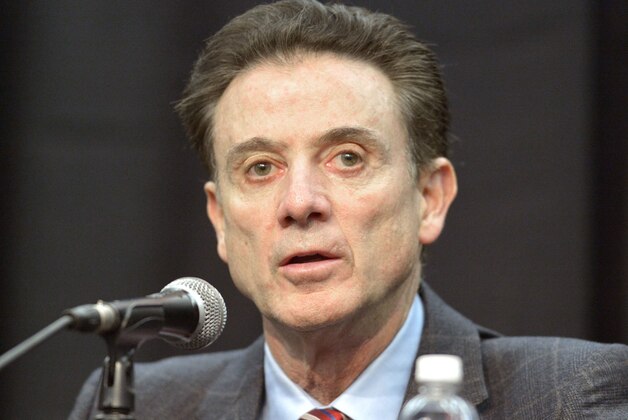 Louisville head basketball coach Rick Pitino listens to a question during a press conference, Friday, Feb. 5, 2016, in Louisville Ky. The University announced a one-year postseason ban for its men's basketball team amid ongoing investigations into a sex scandal in which an escort alleged that a former staffer paid her and other dancers to strip and have sex with recruits and players. (AP Photo/Timothy D. Easley)