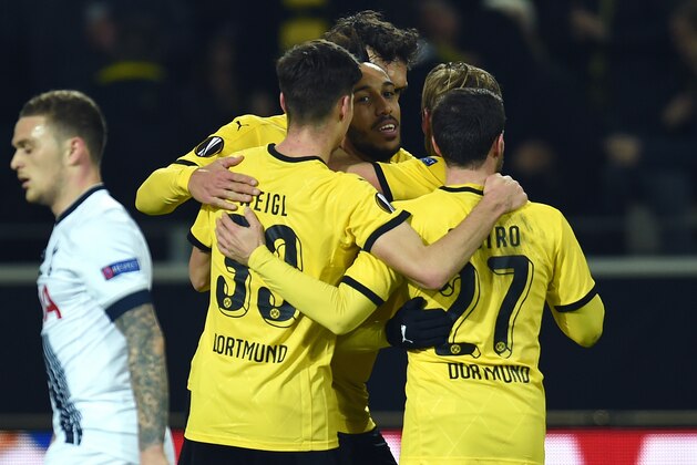 Dortmund's Gabonese striker Pierre-Emerick Aubameyang (C) and his teammates celebrate scoring during the UEFA Europe League Round of 16 first leg football match between Borussia Dortmund and Tottenham Hotspurs in Dortmund , western Germany on March 10, 2016. AFP PHOTO / PATRIK STOLLARZ / AFP / PATRIK STOLLARZ        (Photo credit should read PATRIK STOLLARZ/AFP/Getty Images)
