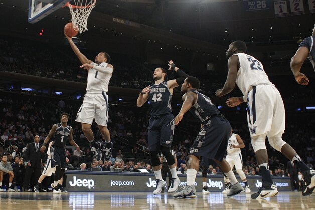 Villanova's Jalen Brunson (1) drives past Georgetown's Bradley Hayes (42) during the first half of an NCAA college basketball game during the Big East men's tournament Thursday, March 10, 2016, in New York. (AP Photo/Frank Franklin II)