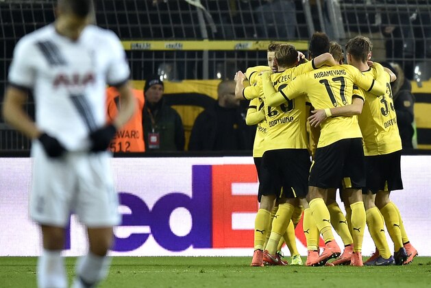 Dortmund's scorer Marco Reus, rear left, and hist teammates celebrate their side's 3rd goal during the Europa League round of 16 first leg soccer match between Borussia Dortmund and Tottenham Hotspur in Dortmund, Germany, Thursday, March 10, 2016. (AP Photo/Martin Meissner)