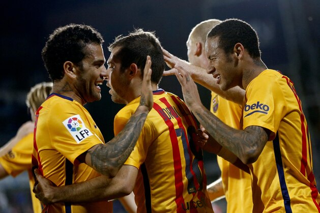 Barcelona's Neymar, right, celebrates after scoring a goal during a Spanish La Liga soccer match between Barcelona and Getafe at the Coliseum Alfonso Perez stadium in Getafe, Spain,  Saturday, Oct. 31, 2015. (AP Photo/Daniel Ochoa de Olza)