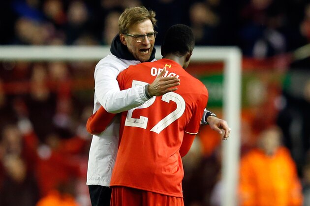 Liverpool manager Juergen Klopp, left, celebrates with Divock Origi at the end of the Europa League round of 16, first leg, soccer match between Liverpool and  Manchester United at Anfield Stadium, Liverpool, England, Thursday March 10, 2016. (AP Photo/Jon Super)