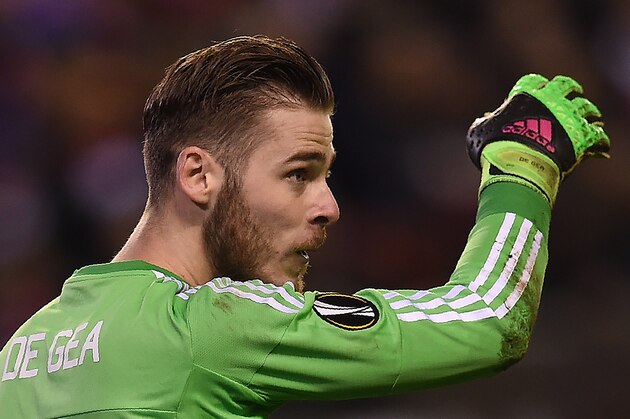 Manchester United's Spanish goalkeeper David de Gea reacts during the UEFA Europa League round of 16, first leg football match between Liverpool and Manchester United at Anfield in Liverpool, northwest England on March 10, 2016. / AFP / PAUL ELLIS        (Photo credit should read PAUL ELLIS/AFP/Getty Images)