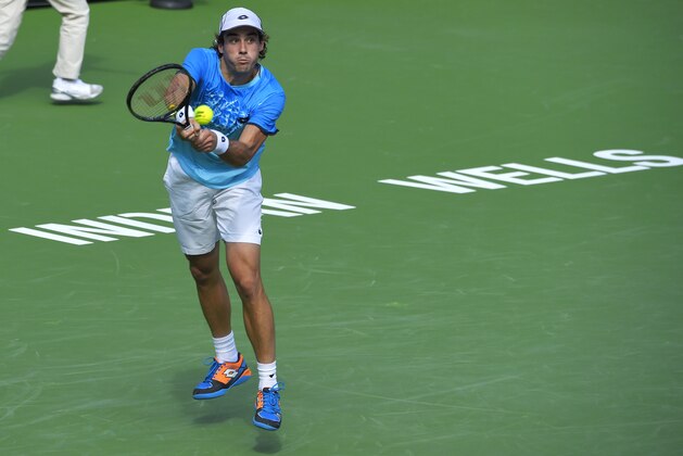 Guido Pella, of Argentina, serves to Kyle Edmund, of Great Britain, during their match at the BNP Paribas Open tennis tournament, Thursday, March 10, 2016, in Indian Wells, Calif. (AP Photo/Mark J. Terrill)