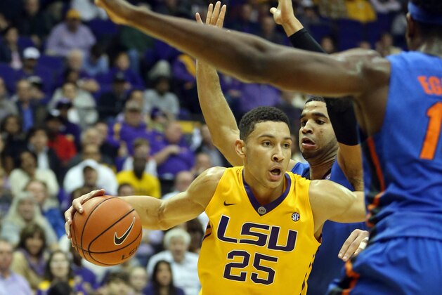 Feb 27, 2016; Baton Rouge, LA, USA; LSU Tigers forward Ben Simmons (25) moves through Florida Gators defenders in the second half of their game at the Pete Maravich Assembly Center. Mandatory Credit: Chuck Cook-USA TODAY Sports