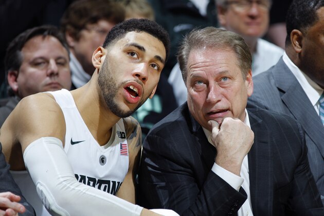Michigan State coach Tom Izzo, right, and Denzel Valentine talk on the bench during the second half of an NCAA college basketball game against Rutgers, Sunday, Jan. 31, 2016, in East Lansing, Mich. Michigan State won 96-62. (AP Photo/Al Goldis)