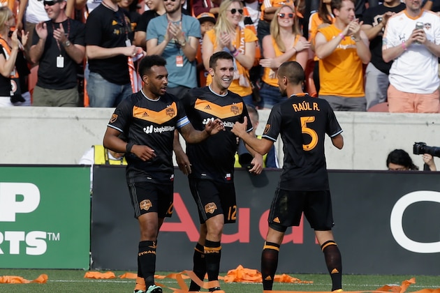 HOUSTON, TX - MARCH 06:  Giles Barnes #10 (L) of Houston Dynamo celebrates with Will Bruin #12 and Raul Rodriguez #5 after scoring against the New England Revolution in the second half at BBVA Compass Stadium on March 6, 2016 in Houston, Texas.  (Photo by Bob Levey/Getty Images)