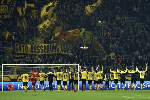 Dortmund's players celebrate in front of their supporters after the Europa League round of 16 first leg soccer match between Borussia Dortmund and Tottenham Hotspur in Dortmund, Germany, Thursday, March 10, 2016. Dortmund defeated Tottenham by 3-0. (AP Photo/Martin Meissner)