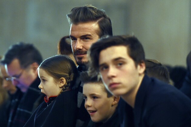 British soccer player David Beckham and his children attend his wife Victoria Beckham's show during the Fall 2016 New York Fashion Week on February 14, 2016, in New York.   / AFP / Jewel Samad        (Photo credit should read JEWEL SAMAD/AFP/Getty Images)