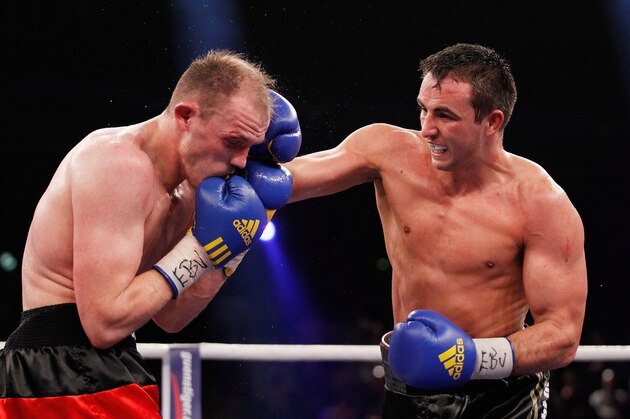 BERLIN, GERMANY - FEBRUARY 02:  Juergen Braehmer (L) of Germany and Eduard Gutknecht of Germany exchange punches during the WBO  European Championship Light Heavyweight title fight at Max-Schmeling Hall on February 2, 2013 in Berlin, Germany.  (Photo by Boris Streubel/Getty Images)