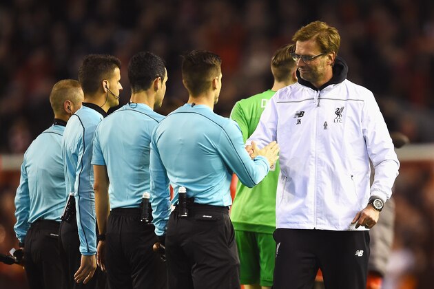 LIVERPOOL, ENGLAND - MARCH 10:  Jurgen Klopp, manager of Liverpool shakes hands with officials after the UEFA Europa League Round of 16 first leg match between Liverpool and Manchester United at Anfield on March 10, 2016 in Liverpool, United Kingdom.  (Photo by Laurence Griffiths/Getty Images)