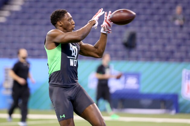 Ohio State receiver Michael Thomas performs a drill at the NFL football scouting combine Saturday, Feb. 27, 2016, in Indianapolis. (AP Photo/Gregory Payan)