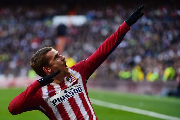 Atletico Madrid's French forward Antoine Griezmann celebrates after scoring during the Spanish league football match Real Madrid CF vs Atletico de Madrid at the Santiago Bernabeu stadium in Madrid on February 27, 2016. / AFP / PIERRE-PHILIPPE MARCOU        (Photo credit should read PIERRE-PHILIPPE MARCOU/AFP/Getty Images)