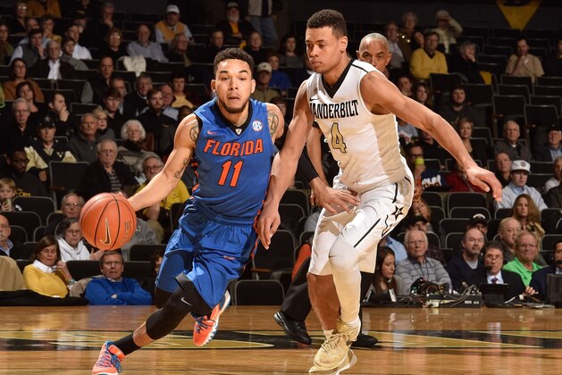 NASHVILLE, TN - JANUARY 26:  Chris Chiozza #11 of the Florida Gators plays against Wade Baldwin IV #4 of the Vanderbilt Commodores during the first half at Memorial Gym on January 26, 2016 in Nashville, Tennessee.  (Photo by Frederick Breedon/Getty Images)