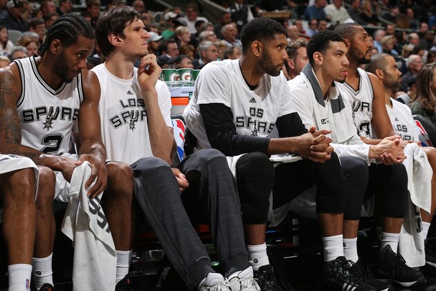 SAN ANTONIO, TX - MARCH 10:  Kawhi Leonard #2, Boban Marjanovic #40, Tim Duncan #21 and Danny Green #14 of the San Antonio Spurs sit on the bench during the game against the Chicago Bulls on March 10, 2016 at the AT&T Center in San Antonio, Texas. NOTE TO USER: User expressly acknowledges and agrees that, by downloading and or using this photograph, user is consenting to the terms and conditions of the Getty Images License Agreement. Mandatory Copyright Notice: Copyright 2016 NBAE (Photos by Joe Murphy/NBAE via Getty Images)