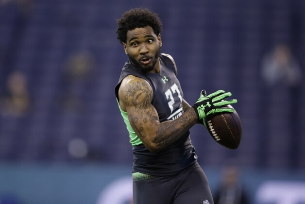 Ohio State receiver Braxton Miller runs a drill at the NFL football scouting combine on Saturday, Feb. 27, 2016, in Indianapolis. (AP Photo/Darron Cummings)