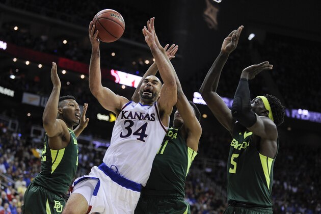 KANSAS CITY, MO - MARCH 11:  Perry Ellis #34 of the Kansas Jayhawks drives to the goal against King McClure #22, Terry Maston #31 and Johnathan Motley #5 of the Baylor Bears in the second half during the semifinals of the Big 12 Basketball Tournament at Sprint Center on March 11, 2016 in Kansas City, Missouri. Kansas won 70-66. (Photo by Ed Zurga/Getty Images)
