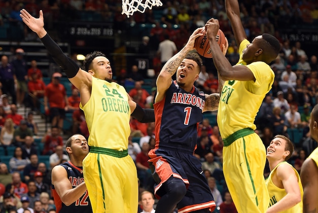 LAS VEGAS, NV - MARCH 11:  Gabe York #1 of the Arizona Wildcats drives to the basket between Dillon Brooks #24 and Chris Boucher #25 of the Oregon Ducks during a semifinal game of the Pac-12 Basketball Tournament at MGM Grand Garden Arena on March 11, 2016 in Las Vegas, Nevada.  (Photo by Ethan Miller/Getty Images)