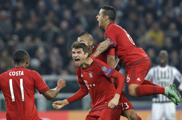 Bayern's Thomas Mueller, center, celebrates after scoring the opening goal during the Champions League, round of 16, first-leg soccer match between Juventus and Bayern Munich at the Juventus stadium in Turin, Italy, Tuesday, Feb. 23, 2016. (AP Photo/Luca Bruno)