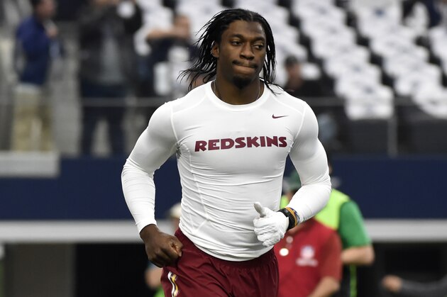 Washington Redskins' Robert Griffin III jogs off the field during warm ups before an NFL football game against the Dallas Cowboys, Sunday, Jan. 3, 2016, in Arlington , Texas. (AP Photo/Michael Ainsworth)