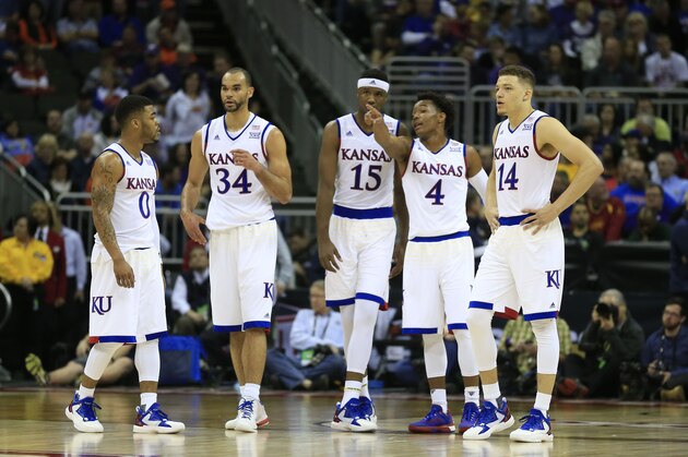 Kansas guard Frank Mason III (0), forward Perry Ellis (34), forward Carlton Bragg Jr. (15), guard Devonte' Graham (4) and guard Brannen Greene (14) during the first half of an NCAA college basketball game against Kansas State in the quarterfinals of the Big 12 conference tournament in Kansas City, Mo., Thursday, March 10, 2016. (AP Photo/Orlin Wagner)