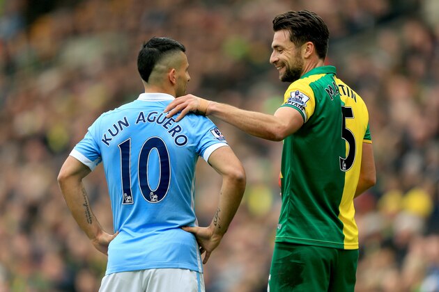 NORWICH, ENGLAND - MARCH 12: Russel Martin of Norwich City and Sergio Aguero of Manchester City talk during the Barclays Premier League match between Norwich City and Manchester City at Carrow Road on March 12, 2016 in Norwich, England.  (Photo by Stephen Pond/Getty Images)