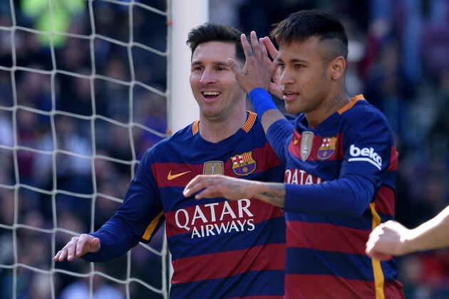 Barcelona's Argentinian forward Lionel Messi (L) and Barcelona's Brazilian forward Neymar celebrate an Getafe's own goal during the Spanish league football match FC Barcelona vs Getafe CF at the Camp Nou stadium in Barcelona on March 12, 2016.     / AFP / LLUIS GENE        (Photo credit should read LLUIS GENE/AFP/Getty Images)