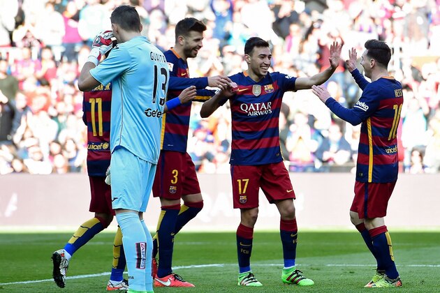 Barcelonas forward Munir El Haddadi (2ndR) is congratulated by his teammates Barcelona's defender Gerard Pique (3rdR) and Barcelona's Argentinian forward Lionel Messi (R) after scoring during the Spanish league football match FC Barcelona vs Getafe CF at the Camp Nou stadium in Barcelona on March 12, 2016.     / AFP / JOSEP LAGO        (Photo credit should read JOSEP LAGO/AFP/Getty Images)