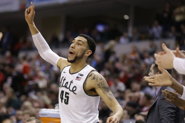Michigan State's Denzel Valentine (45) reacts on the bench during the second half of an NCAA college basketball game against Ohio State in the quarterfinals at the Big Ten Conference tournament, Friday, March 11, 2016, in Indianapolis. AP Photo/Michael Conroy)