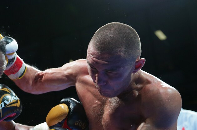 ORLANDO, FL - OCTOBER 30: Sergey Lipinets (R) punches Haskell Rhodes during the Premier Boxing Champions on Bounce TV boxing match at The Venue at UCF on October 30, 2015 in Orlando, Florida. (Photo by Alex Menendez/Getty Images)