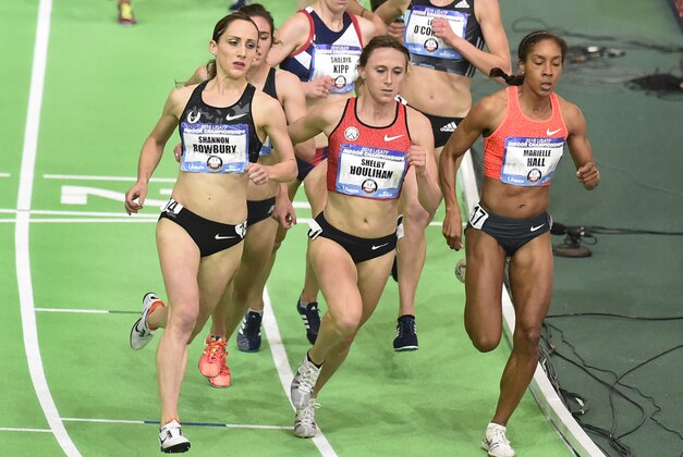 Shannon Rowbury, left, passes Shelby Houlihan and Mariele Hall, right, on the final lap on her way to winning the women's 3,000 meters at the U.S. indoor track and field championships in Portland, Ore., Friday, March 11, 2016. (AP Photo/Steve Dykes)