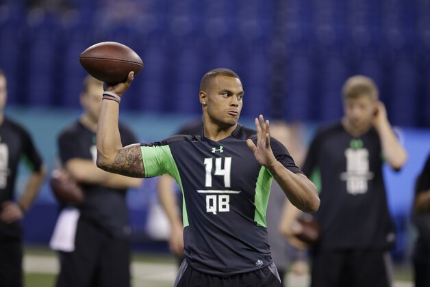 Mississippi State quarterback Dak Prescott runs a drill at the NFL football scouting combine on Saturday, Feb. 27, 2016, in Indianapolis. (AP Photo/Darron Cummings)