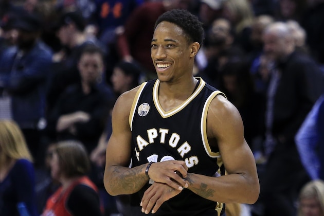 TORONTO, ON - MARCH 12:  DeMar DeRozan #10 of the Toronto Raptors smiles during overtime of an NBA game against the Miami Heat at the Air Canada Centre on March 12, 2016 in Toronto, Ontario, Canada.  NOTE TO USER: User expressly acknowledges and agrees that, by downloading and or using this photograph, User is consenting to the terms and conditions of the Getty Images License Agreement.  (Photo by Vaughn Ridley/Getty Images)
