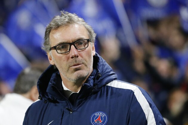 PSG head coach Laurent Blanc looks on from the touchline just prior to the start of the  Champions League round of 16 second leg soccer match between Chelsea and Paris Saint Germain, at Stamford Bridge stadium in London, Wednesday, March, 9, 2016. (AP Photo/Frank Augstein)