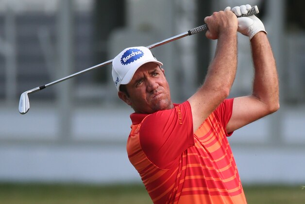 Scott Hend of Australia hits a shot from the fairway on the 17th hole during round 2 at the Hong Kong Open golf tournament in Hong Kong Friday, Oct. 23, 2015. (AP Photo/Kin Cheung)