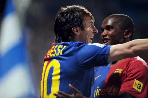 FC Barcelona's Lionel Andres Messi (L) celebrates with Samuel Eto??o (R) after scoring against Recreativo Huelva during their Spanish league football match at the Nuevo Colombino's stadium in Huelva, on November 16, 2008. AFP PHOTO / CRISTINA QUICLER (Photo credit should read CRISTINA QUICLER/AFP/Getty Images)