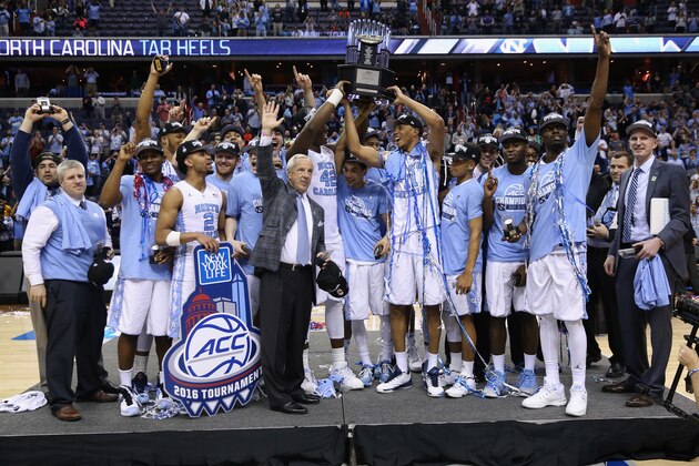 WASHINGTON, DC - MARCH 12:  The North Carolina Tar Heels hold up the conference trophy after defeating the Virginia Cavaliers 61-57 to win the 2016 ACC Basketball Tournament at Verizon Center on March 12, 2016 in Washington, DC.  (Photo by Rob Carr/Getty Images)