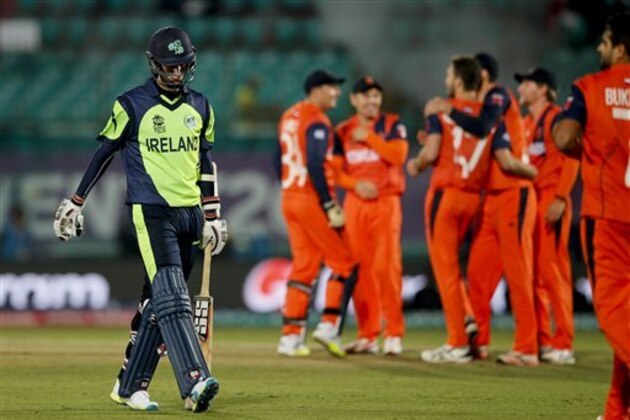 Ireland's George Dockrell walks back after his dismissal by Netherlands Paul van Meekeren, during the ICC World Twenty20 2016 cricket tournament at the Himachal Pradesh Cricket Association (HPCA) stadium in Dharamsala, India, Sunday, March 13, 2016(AP Photo /Tsering Topgyal)