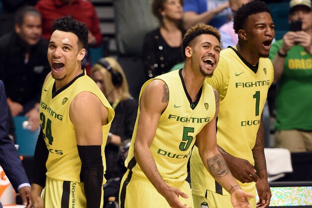 LAS VEGAS, NV - MARCH 12:  Dillon Brooks #24, Tyler Dorsey #5 and Jordan Bell #1 of the Oregon Ducks celebrate their 88-57 victory over the Utah Utes to win the championship game of the Pac-12 Basketball Tournament at MGM Grand Garden Arena on March 12, 2016 in Las Vegas, Nevada.  (Photo by Ethan Miller/Getty Images)